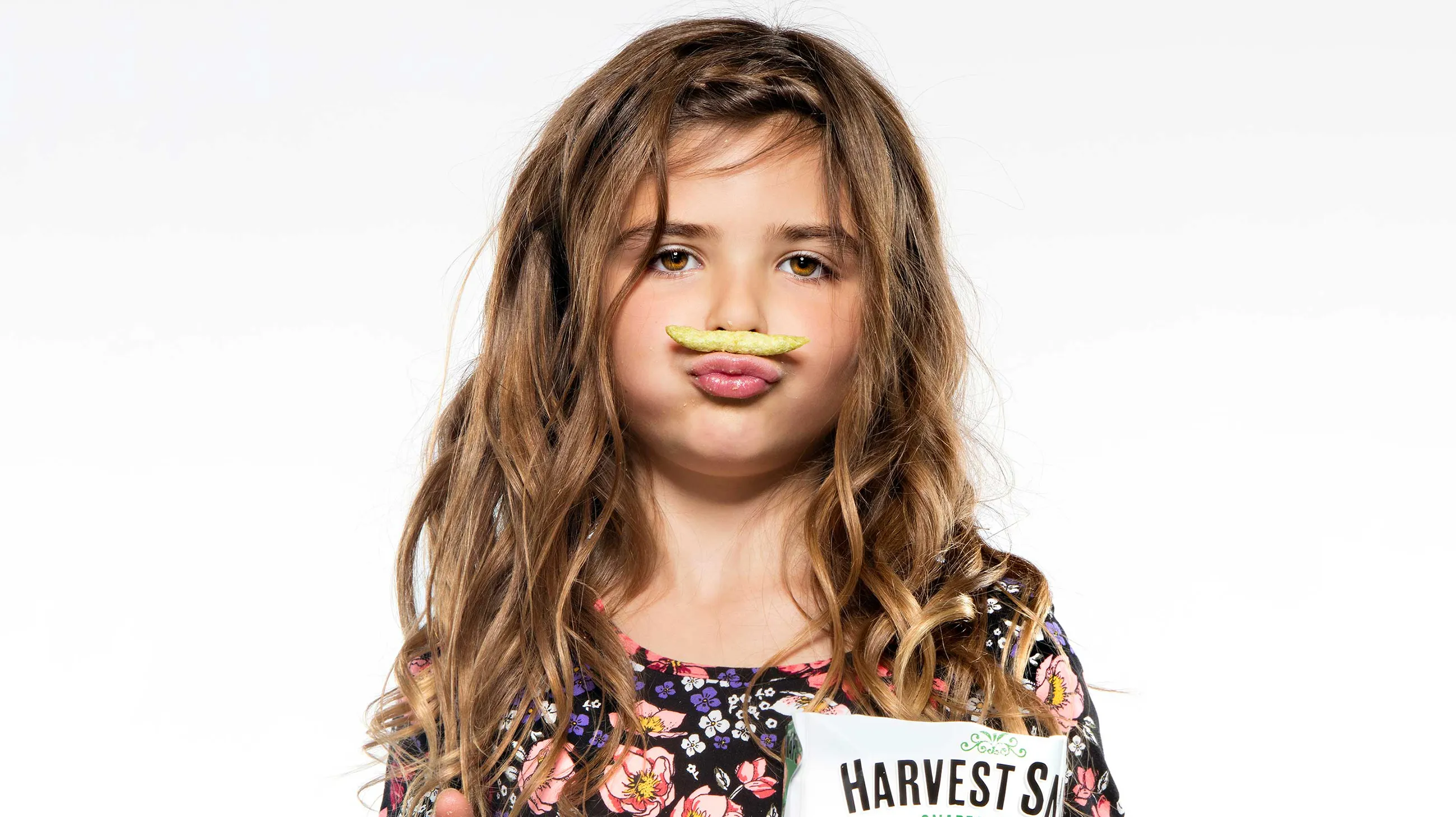 Girl with a snap balanced above her lip