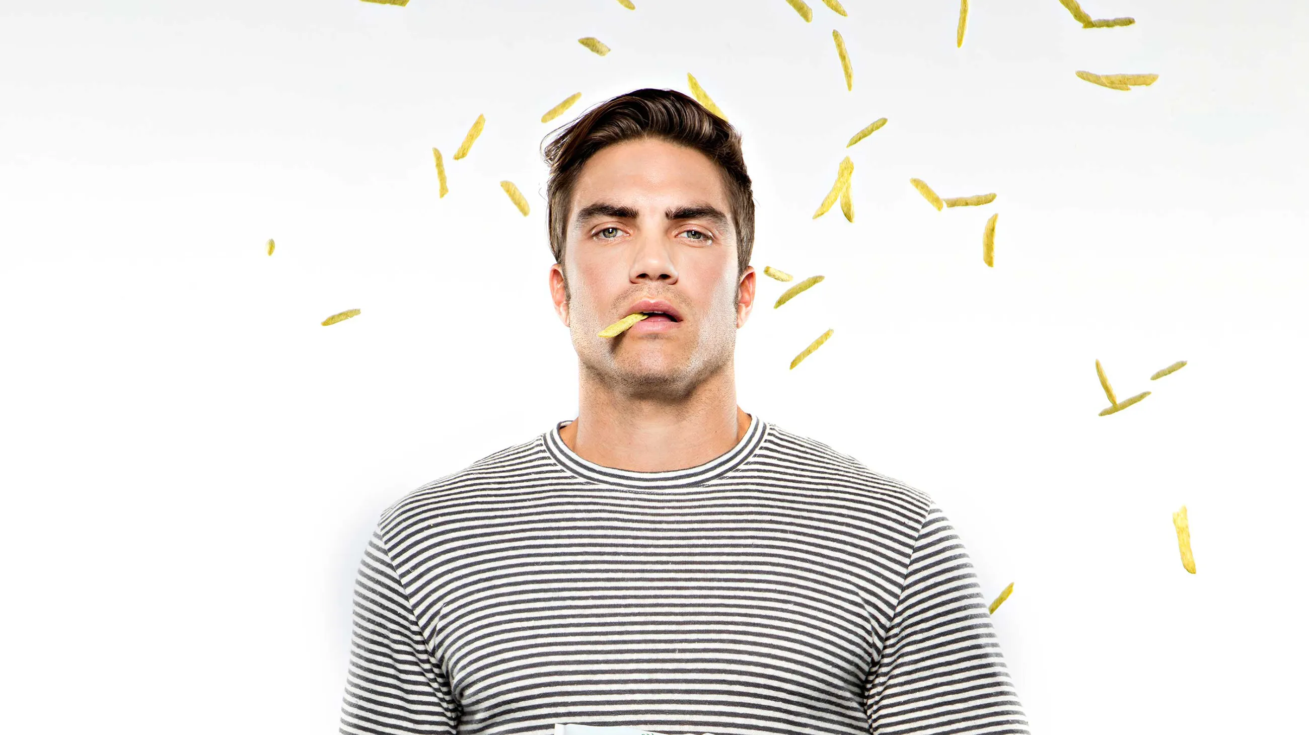 Man with snaps hanging out of his mouth